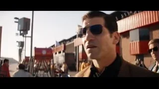 two men in sunglasses in front of building — Ford v Ferrari