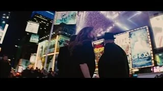 three people walking in Times Square at night — Now You See Me
