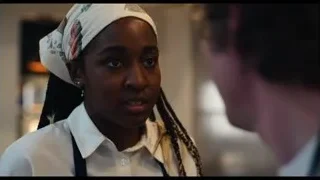 woman in chef's hat in kitchen restaurant setting — The Bear