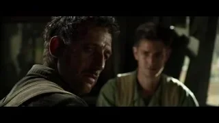 Two men with serious expressions in dimly lit room — Hacksaw Ridge