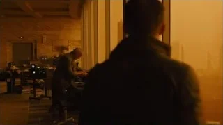 men in control room viewing city skyline — Blade Runner 2049