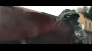 Man in red cape fighting in city — Superman: Man of Steel