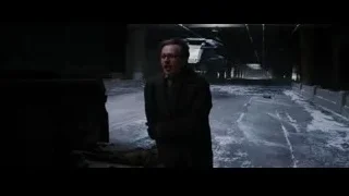 man looking at truck in dark tunnel — Batman: The Dark Knight Rises