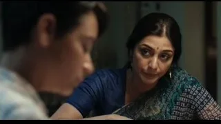 Woman in blue saree and man at table — Life of Pi