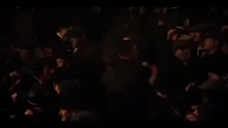 chaotic crowd gathered in dark room — Peaky Blinders
