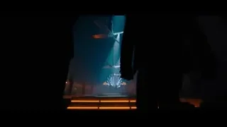 silhouettes on stage with blue orange lights — John Wick: Chapter 4