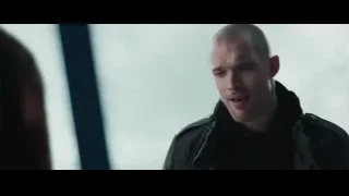 Bald man in black leather jacket by window — Deadpool