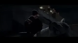 man with knife on ledge at night — The Amazing Spider Man