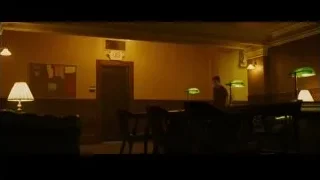 dimly lit room with bulletin board — Whiplash