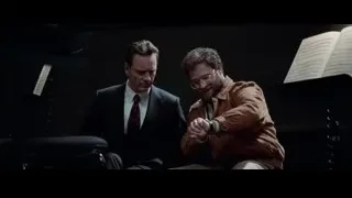 two men in dim room with music stands — Steve Jobs