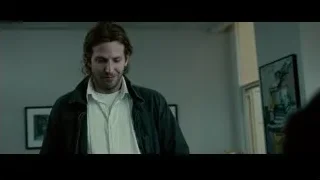 man in black jacket with framed pictures — Limitless