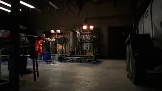 man working in dimly lit workshop — Breaking Bad