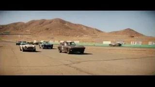 vintage sports cars racing on desert track — Ford v Ferrari
