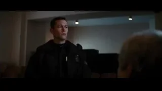 police officer in dark room talking to woman — Batman: The Dark Knight Rises