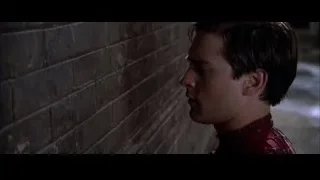 man in Spiderman suit leaning on brick wall — Spider Man 2