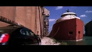 large red ship docked in harbor — Batman: The Dark Knight