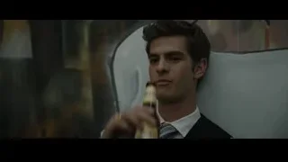 young man in suit drinking beer — The Social Network