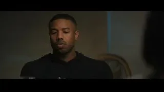 Close-up of man's face in black hoodie — Creed 2