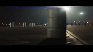 black sports car driving at night — Ford v Ferrari