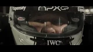 person looking through helmet in garage — F1