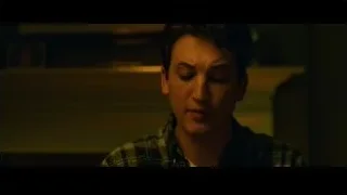 young man in plaid shirt smiling — Whiplash