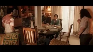 Man in suit speaking at dining table — Jobs