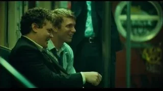 two men in suits on a train — Joker