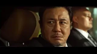 serious Asian man's face in car — Lucy