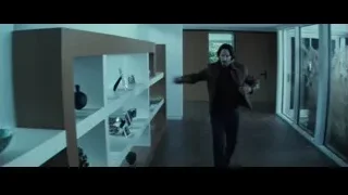 Man walking in modern hallway — John Wick