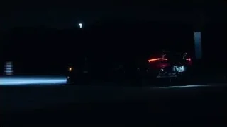 red sports car driving on highway at night — Sports Cars