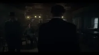 Men in formal attire at dimly lit bar — Peaky Blinders