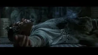 Man lying on ground with gun nearby — The Matrix