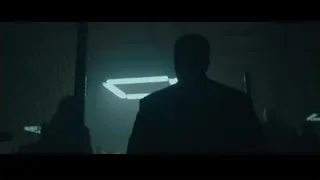 people in dimly lit room with city view — Creed 2