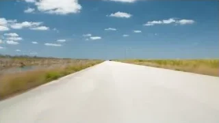 black sports car driving on road — Sports Cars