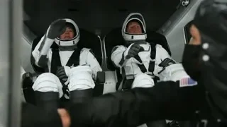 Two astronauts sitting in spacecraft cockpit — Elon Musk: Return to Space