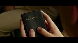 person holding old worn Bible — Hacksaw Ridge