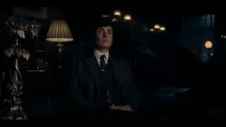 Man in suit sitting in dimly lit room — Peaky Blinders