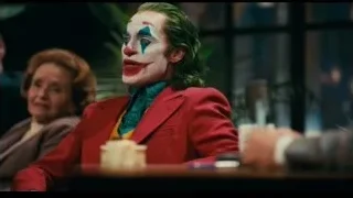 Joker sitting at a restaurant table — Joker