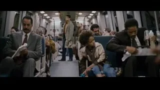 Man and boy on subway train — The Persuit of Happyness