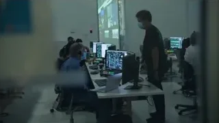 people working on computers in control room — Elon Musk: Return to Space