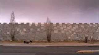 person sitting on ground by concrete wall — Breaking Bad