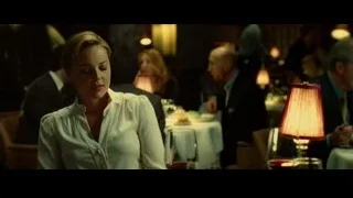 woman sitting deep in thought in dimly lit restaurant — Limitless