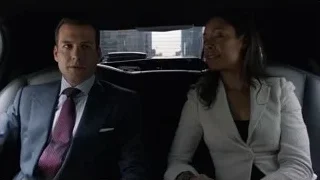 man and woman in car backseat — Suits