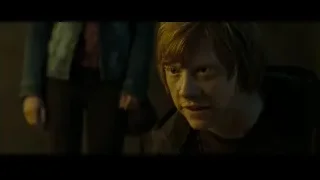 young man looking serious in dimly lit room — Harry Potter and the Deathly Hallows 2