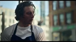 young man with apron deep in thought — The Bear