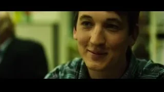 young man smiling in plaid shirt — Whiplash