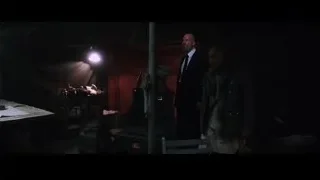 man and robot in dimly lit room — Iron Man