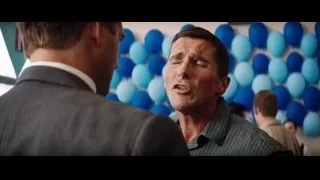 two men talking in room with blue balloons — Ford v Ferrari