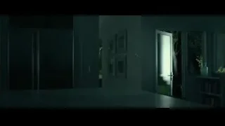 person searching with flashlight in dimly lit room — John Wick