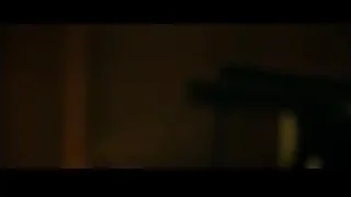 Young man with slight smile in dark room — Whiplash